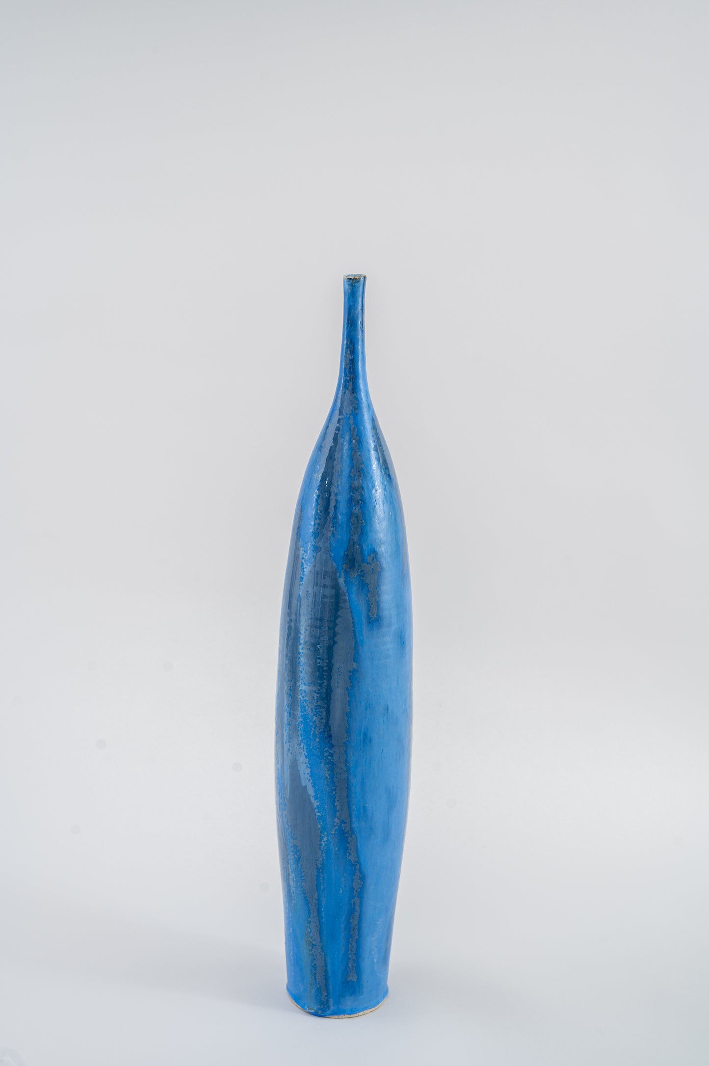 Tall Thin Blue Ceramic Bottle